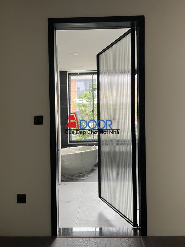Cửa đi nhôm Adoor slim mở quay được lắp đặt tại một không gian phòng khách, tối ưu không gian